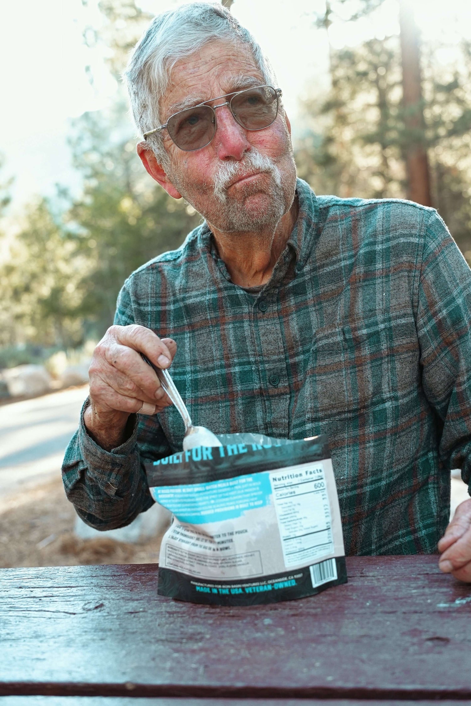 Rugged Provisions granola bag on campsite table